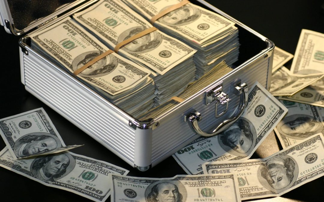 grey metal case of hundred dollar bills