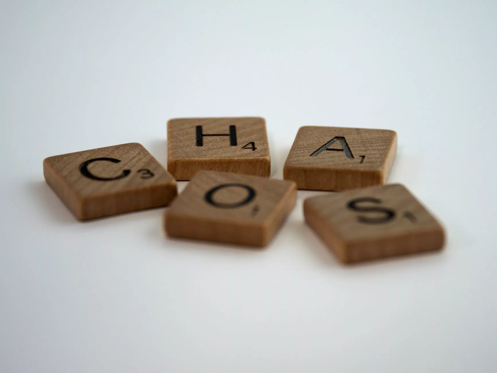 close up shot of scrabble tiles on a white surface