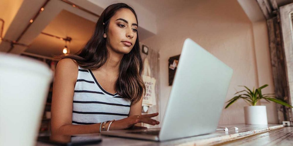 female-works-on-laptop-at-the-office