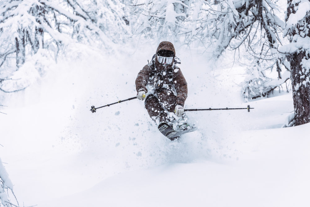 A person skiing through the snow. Haglöfs Winter 2021.