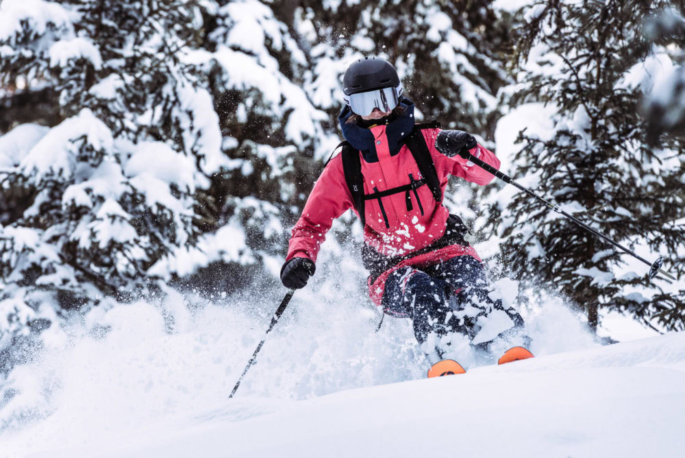 A person riding skis down a snowy slope. Haglöfs Winter 2021.