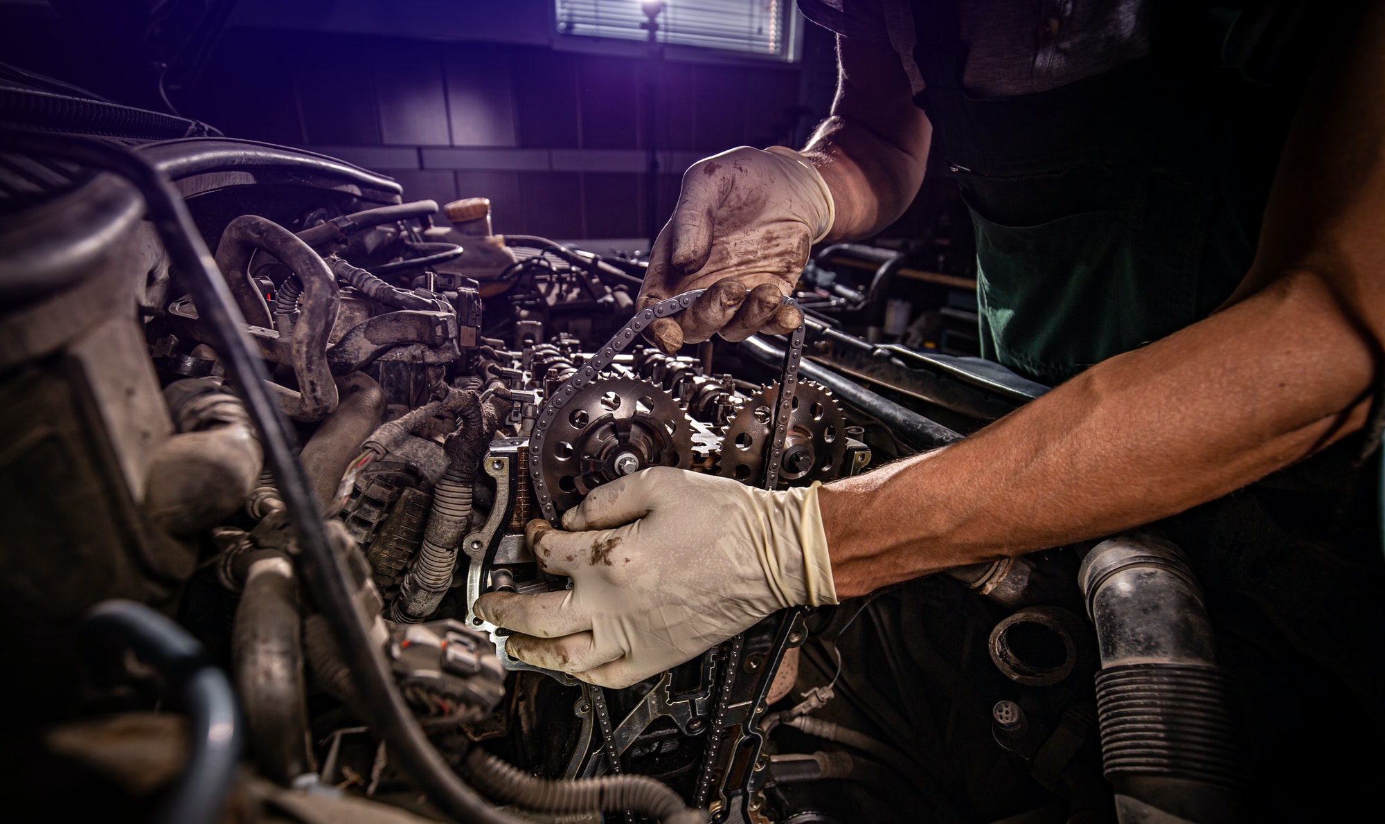 Car mechanic in garage