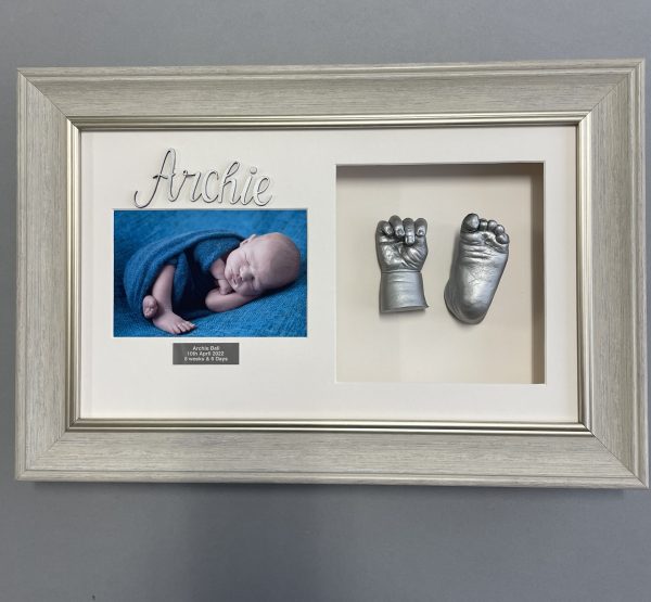 2 Cast frame with wooden name