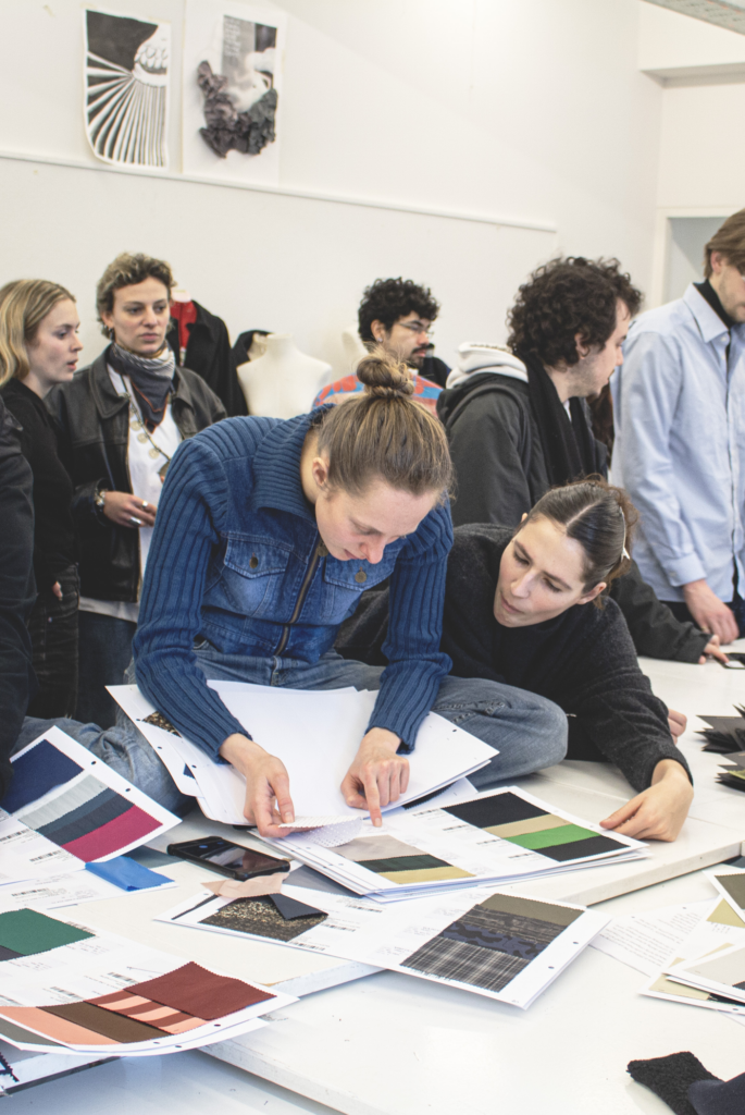 Students choosing between fabrics from at the Bakermat RE/SOURCE event.