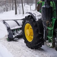 big-special-tractor-is-removing-snow-from-forestal-road_613910-13787