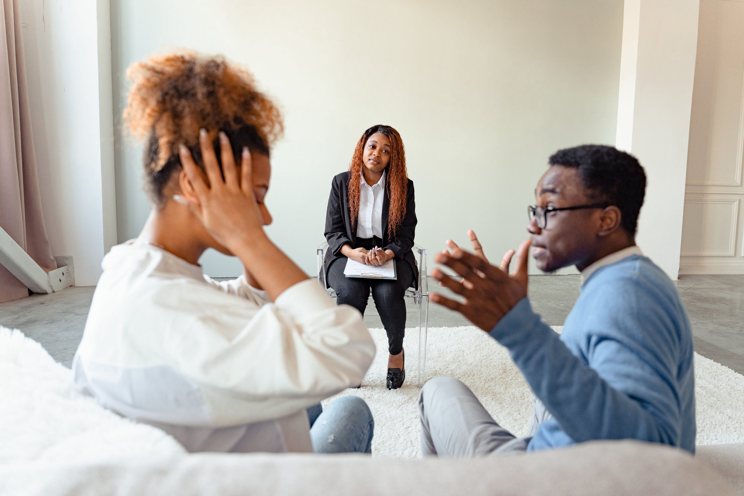 A Black couple undergoing dispute resolution
