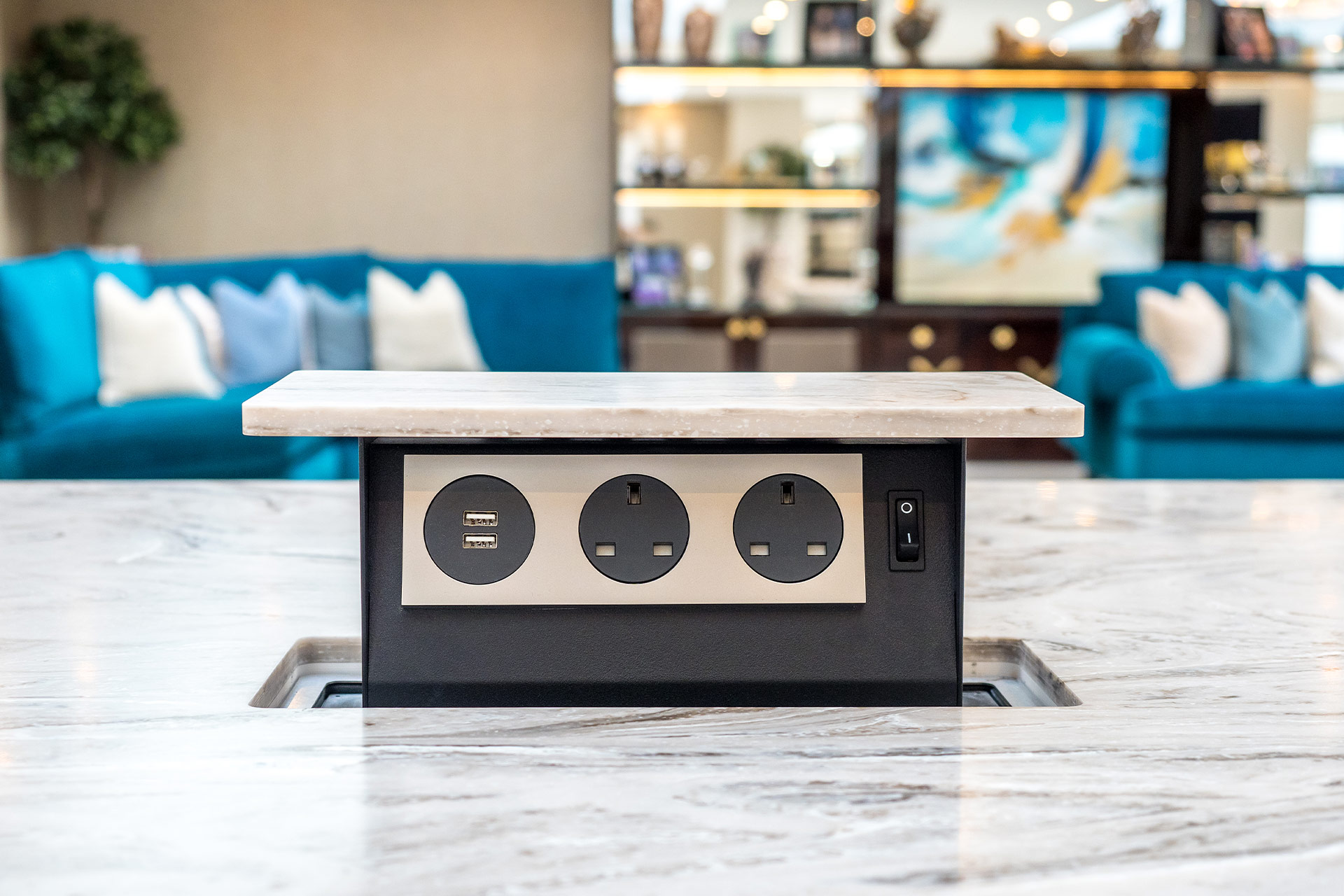 Integrated pop up socket in designer kitchen island