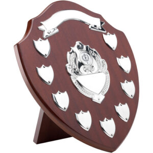 MAHOGANY SHIELD WITH CHROME FRONTS AND 9 RECORD SHIELDS (1in CENTRE) - 12.75in