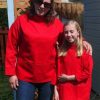 Sharon and Jennifer wearing matching red smocks
