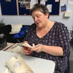 Lesley busy cutting out collage items