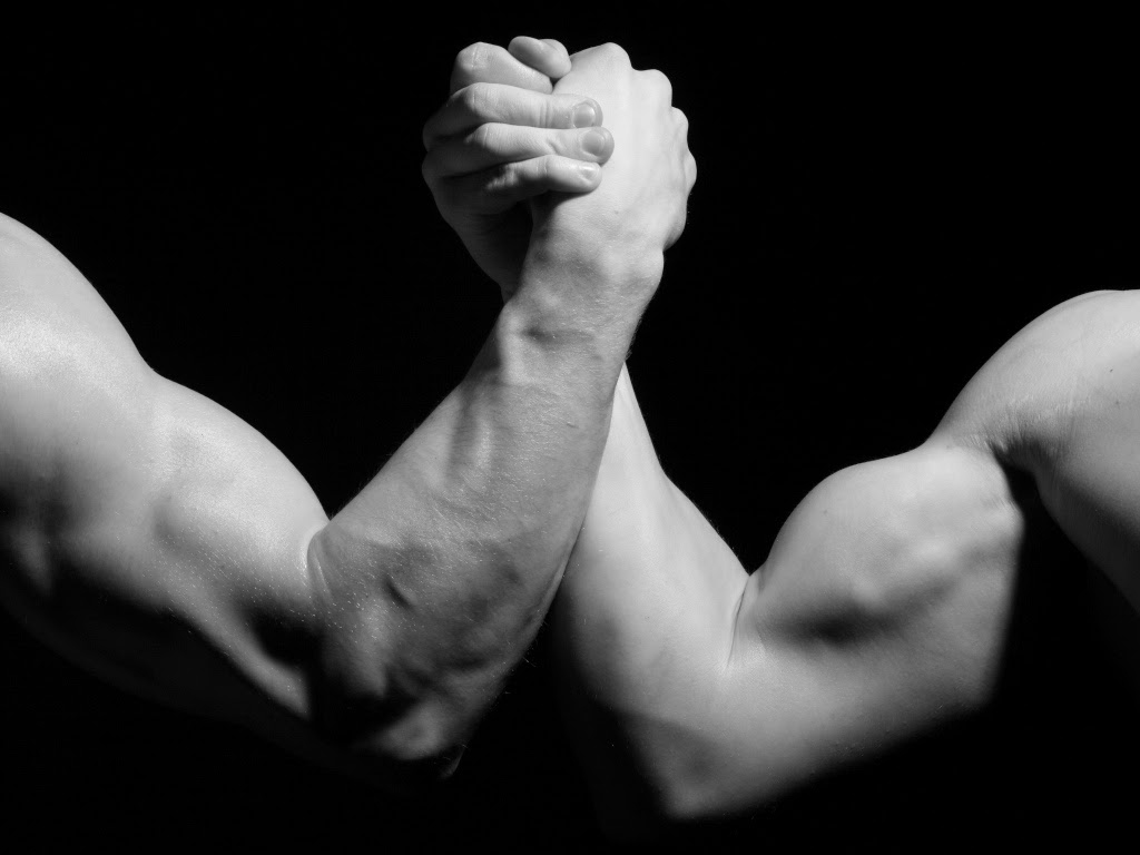 The Self vs. The Ego BE(YOU)FULL image showing two interlocked arms as a symbol of inner strength, resistance, agency, identity and human development