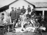 THE SCOTTISH WOMEN'S HOSPITAL IN SERBIA DURING THE FIRST WORLD WAR (Q 111231) Miss Alice Tebbutt (centre) with Serbian troops, including men with sewing machines and a young boy, Serbia. Copyright: � IWM. Original Source: http://www.iwm.org.uk/collections/item/object/205353843