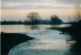 5th January 2003, Flood water cascade over the back at  Brownshill Staunch.