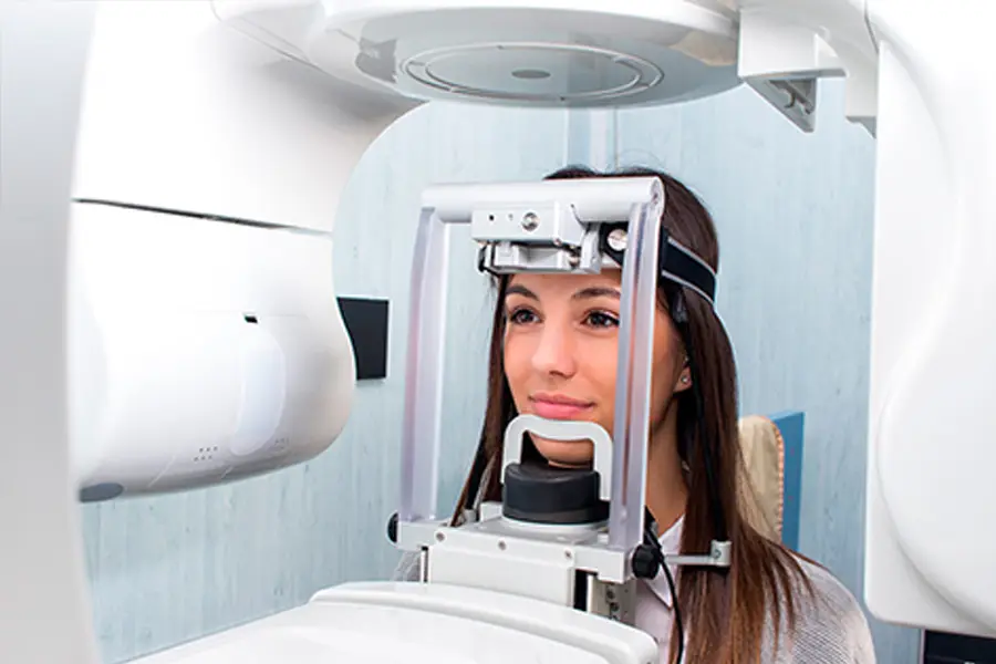 An image of someone getting a 3D dental scan at Bicester Dental. The person looks relaxed and happy with the treatment that will come from this.