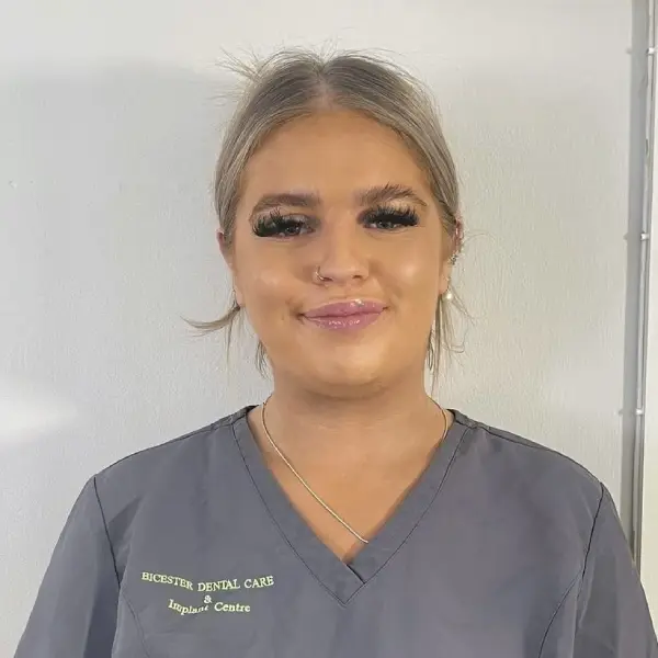 An image of Bicester Dental's trainee dental nurse, Ellie Brewster. Here she is smiling pleasantly at the camera.