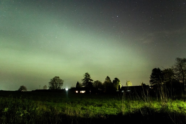 April 23 2023 between 22 :00 and 23:00, all of the North glowing, our house to the right (looking East), Græsted, Denmark.