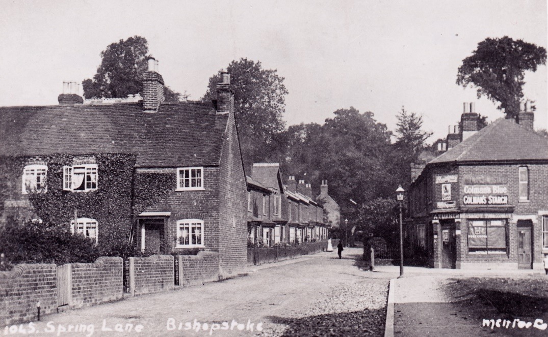 A black and white photo of a row of houses Description automatically generated with low confidence