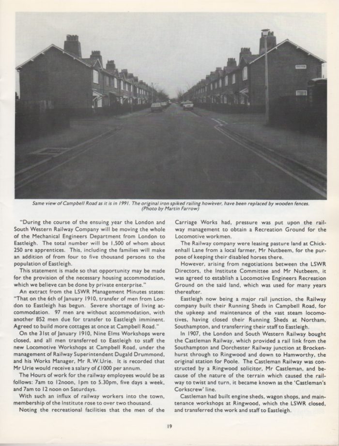 A black and white photo of a street with buildings on the side Description automatically generated with low confidence
