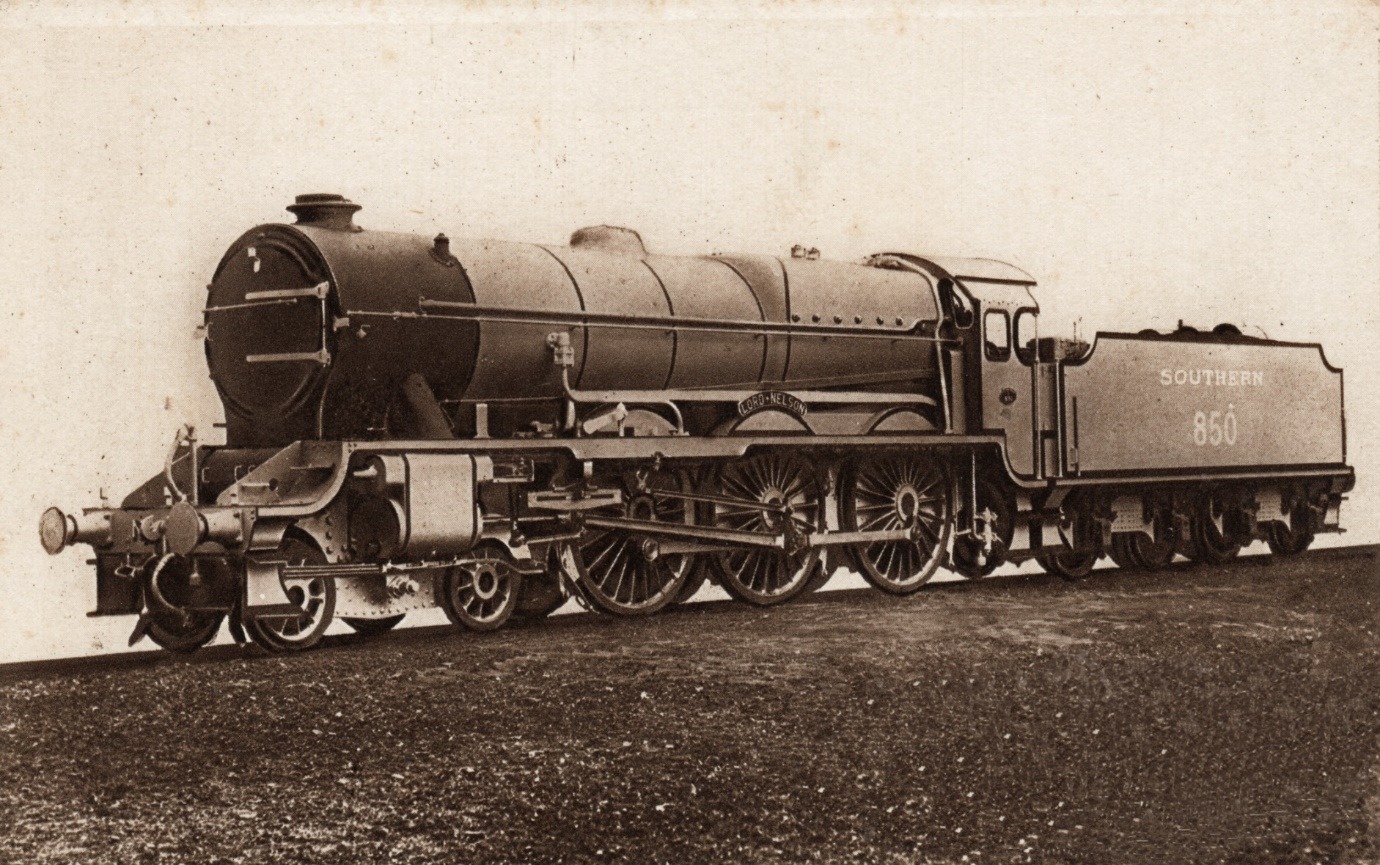 A black and white photo of a train on a track Description automatically generated with medium confidence