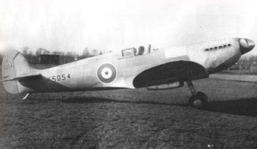 A black and white photo of an airplane on a field Description automatically generated with medium confidence