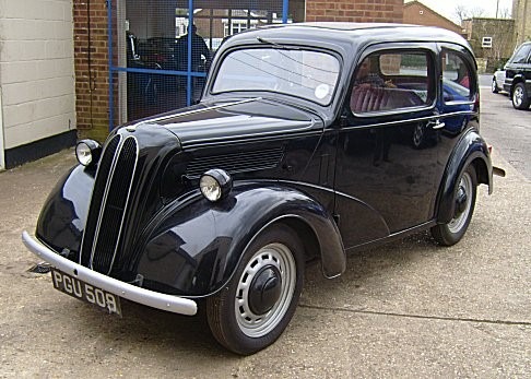 A black car parked on a street Description automatically generated with low confidence