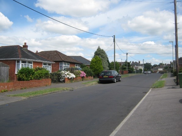 A car driving down a street Description automatically generated with medium confidence