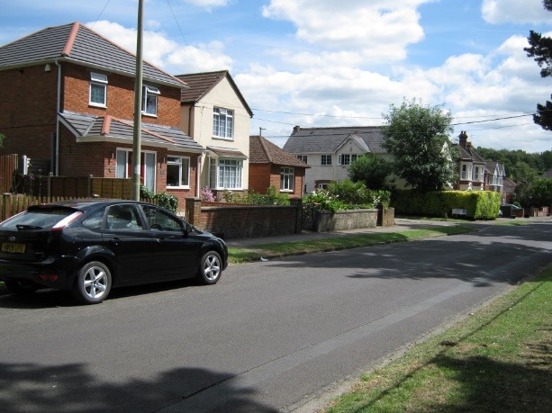 A car parked on the side of a road Description automatically generated with medium confidence