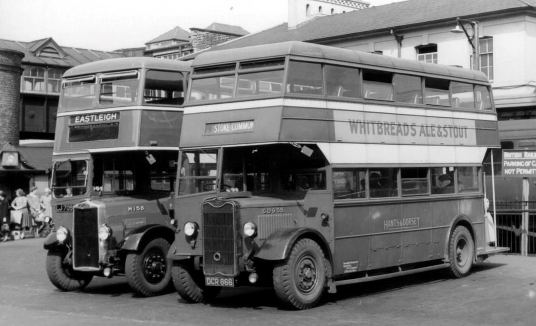 A couple of double decker buses parked next to each other Description automatically generated with medium confidence