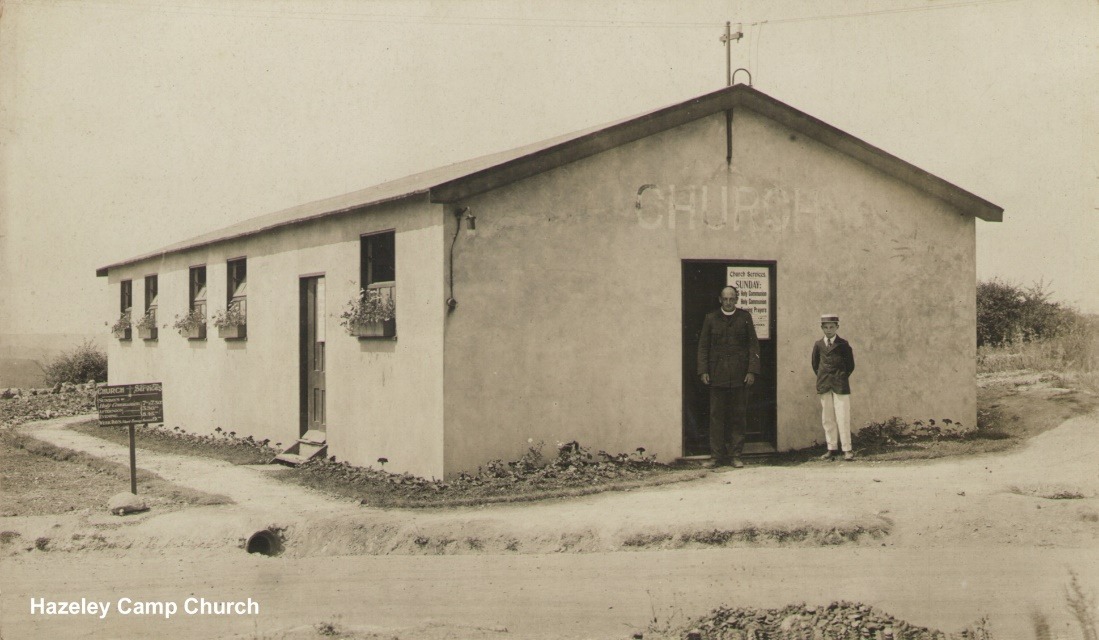 A couple of men standing outside a building Description automatically generated with low confidence