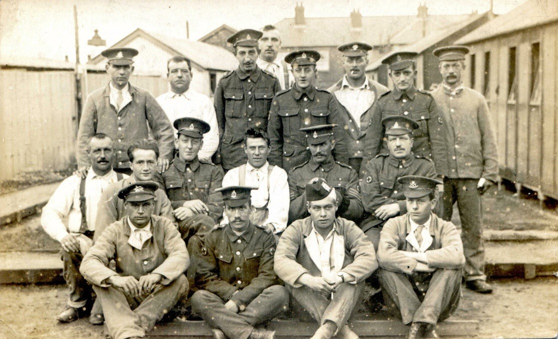 A group of men posing for a photo Description automatically generated