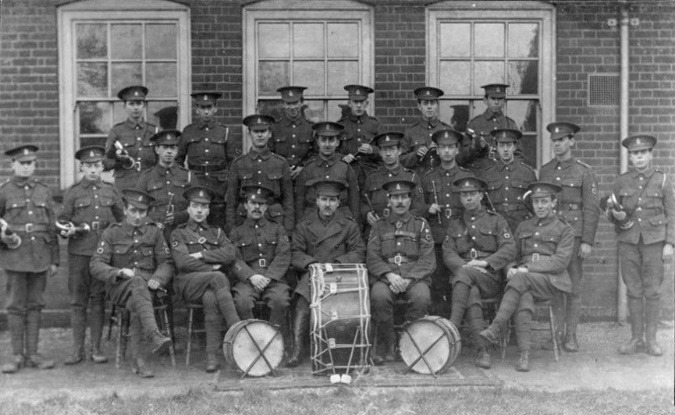 A group of men posing for a photo Description automatically generated with medium confidence