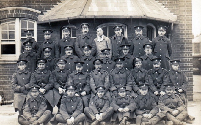 A group of men posing for a photo Description automatically generated with medium confidence