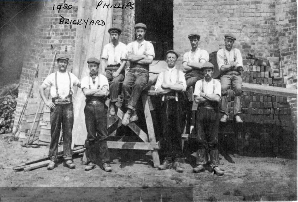 A group of men posing for a photo Description automatically generated with medium confidence