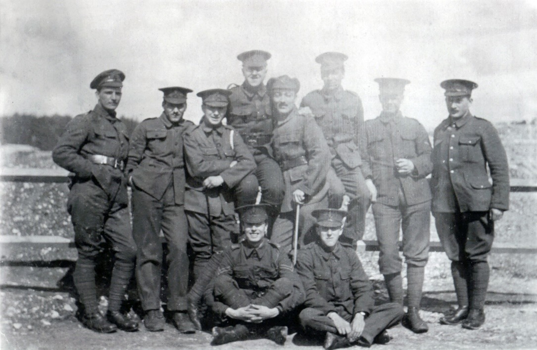 A group of men posing for a photo Description automatically generated