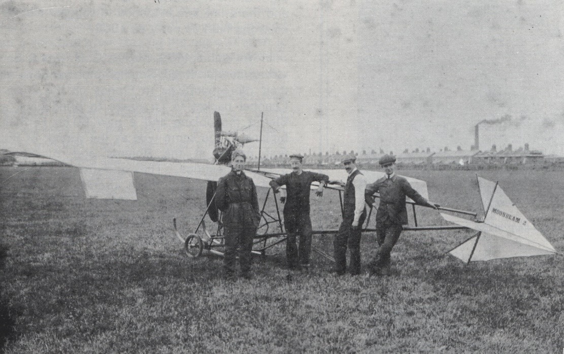 A group of men standing next to a plane Description automatically generated with medium confidence