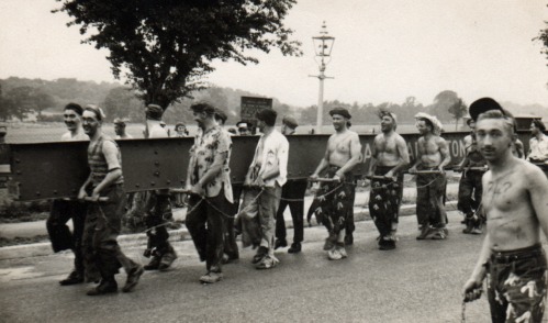 A group of people marching Description automatically generated with low confidence