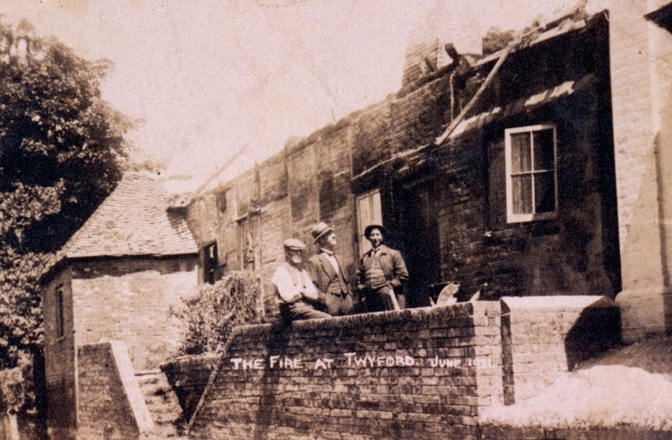 A group of people sitting on a roof of a house Description automatically generated with low confidence