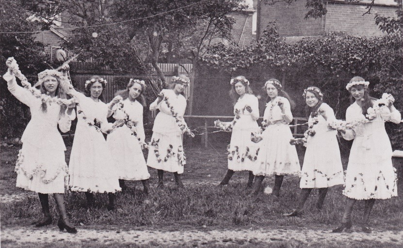 A group of women in dresses Description automatically generated with low confidence