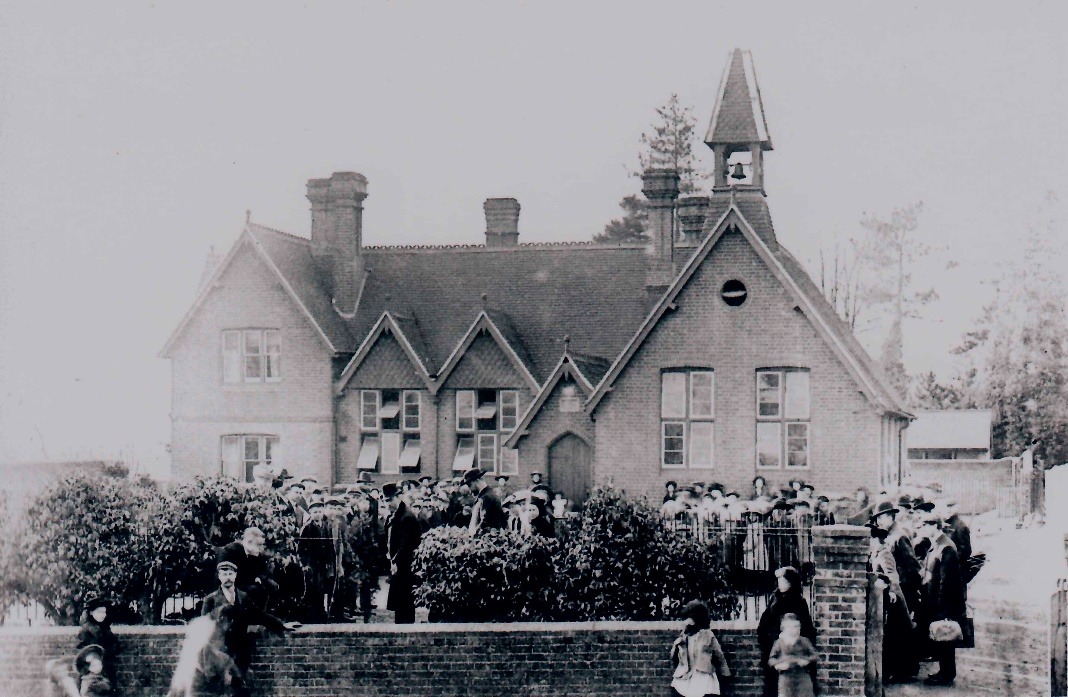 A large group of people outside a building Description automatically generated with low confidence