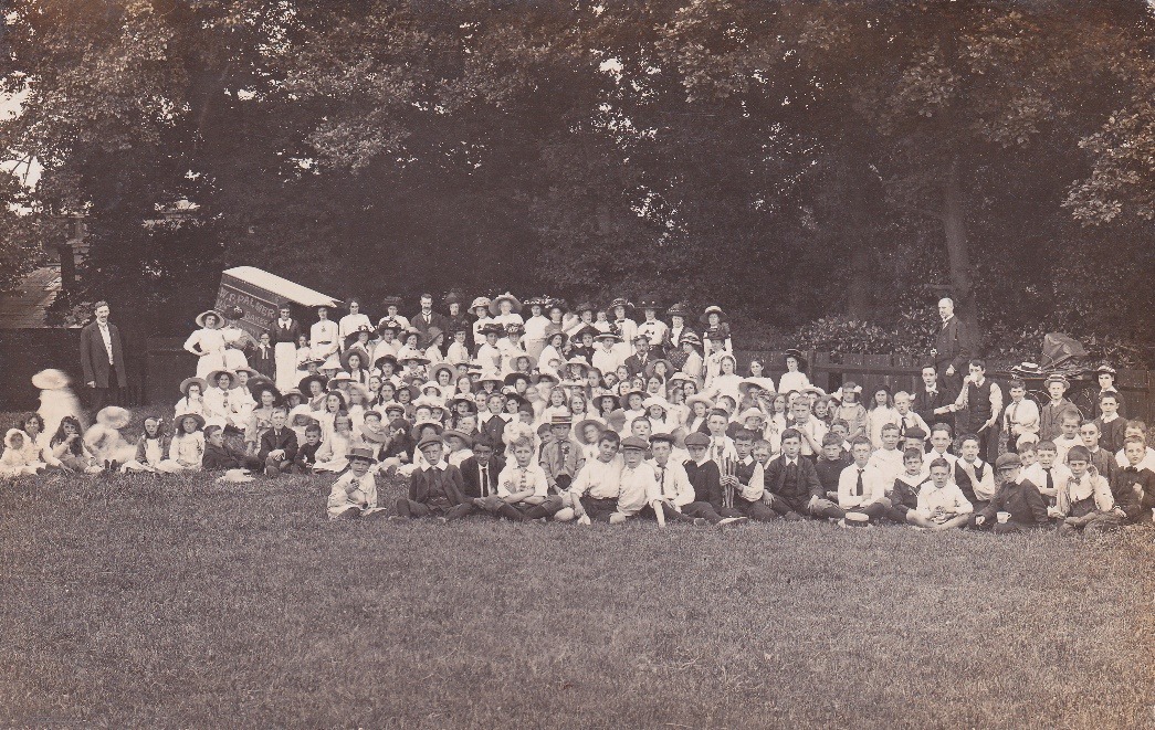 A large group of people posing for a photo Description automatically generated with medium confidence