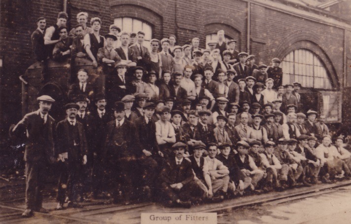 A large group of people posing for a photo Description automatically generated with medium confidence