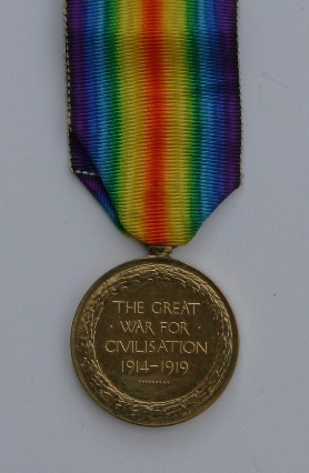 A medal on a white surface Description automatically generated with medium confidence