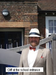 A person wearing a hat and bow tie Description automatically generated with low confidence