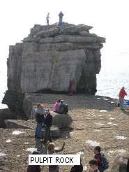 A picture containing outdoor, people, stone Description automatically generated