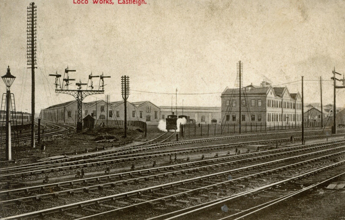 A picture containing text, track, train, outdoor Description automatically generated