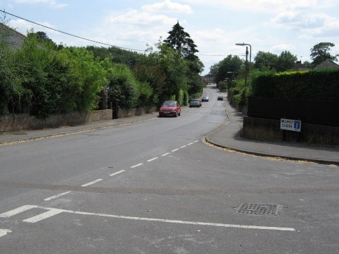 A road with cars on it Description automatically generated with low confidence