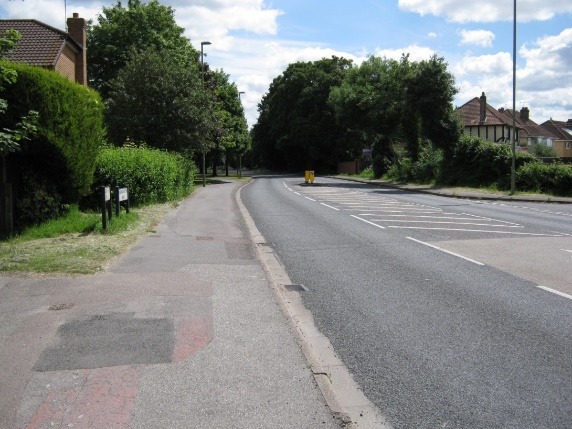 A road with trees on the side Description automatically generated with low confidence