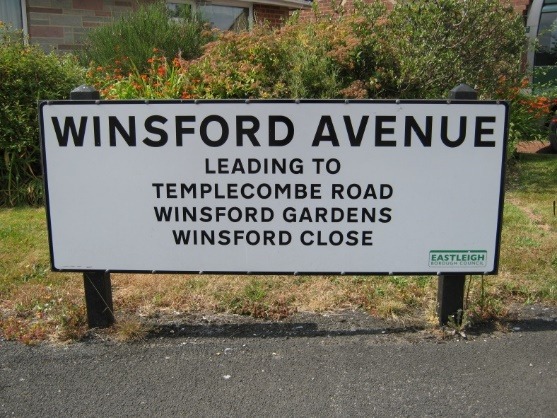 A sign on the side of a road Description automatically generated with medium confidence