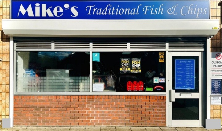 A store front with a sign AI-generated content may be incorrect.