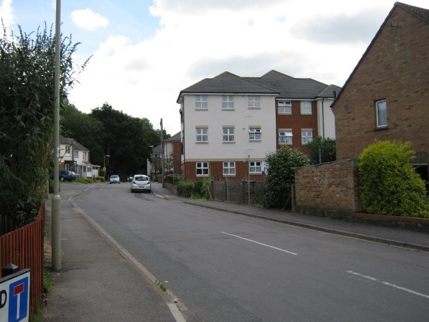 A street with houses on the side Description automatically generated with low confidence